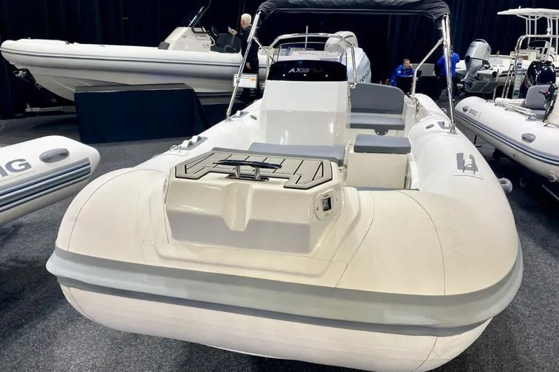 Slide: The Image of 2026 Northstar Axis 5.3 boat with Yamaha 115HP engine displayed at a boat show. - 7