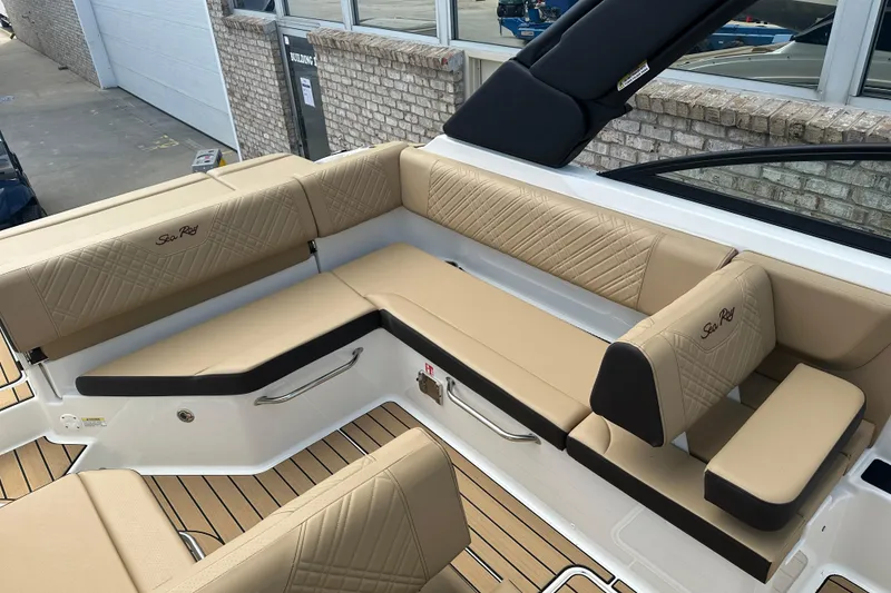Slide: The Image of 2026 Sea Ray SDX 250 boat interior with beige seating and elegant design. - 11