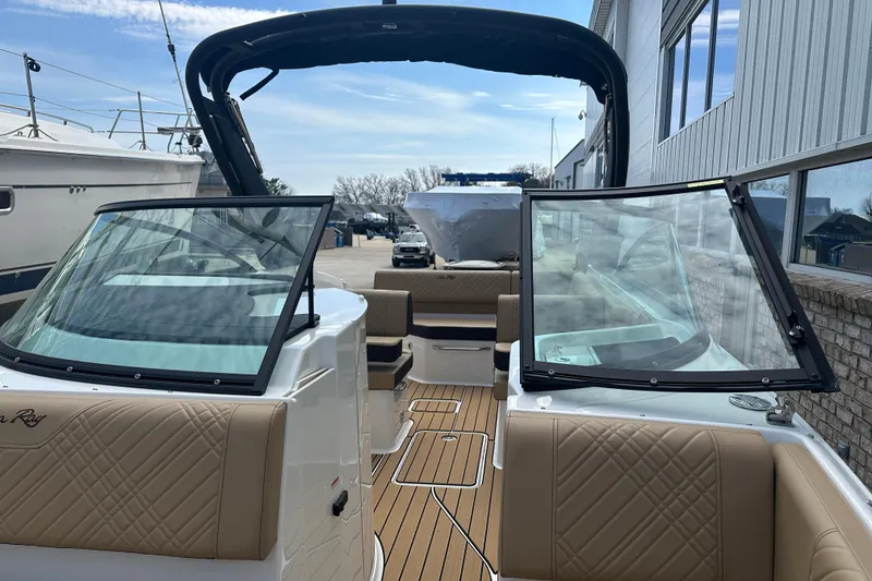Slide: The Image of 2026 Sea Ray SDX 250 boat interior with tan upholstery and open deck layout. - 5