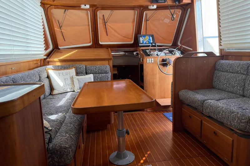 Slide: The Image of Cozy interior of 1997 Sabreline 36 Express yacht with wood finish and seating area. - 11