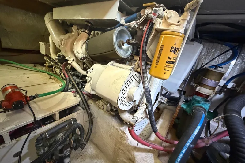Slide: The Image of Engine room of a 1997 Sabreline 36 Express boat, showcasing mechanical components. - 18