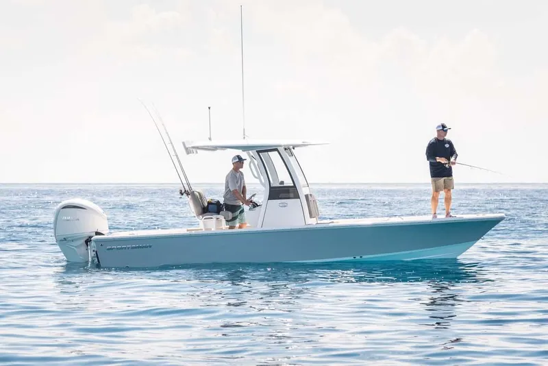 Slide: The Image of Manufacturer Provided Image: 2025 Sportsman Masters 247 Bay Boat on water with two people fishing. - 4