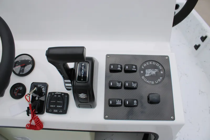 Slide: The Image of Control panel of 2026 Freedom Boats 19 PATRIOT with throttle and switches. - 12