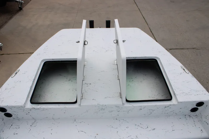 Slide: The Image of 2026 Freedom Boats 19 PATRIOT deck with open storage compartments. - 14