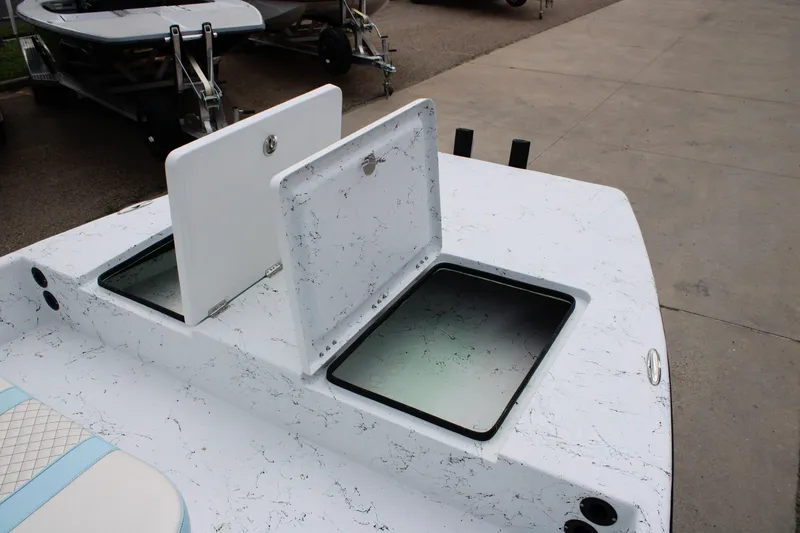 Slide: The Image of 2026 Freedom Boats 19 PATRIOT with open storage compartments on deck. - 15