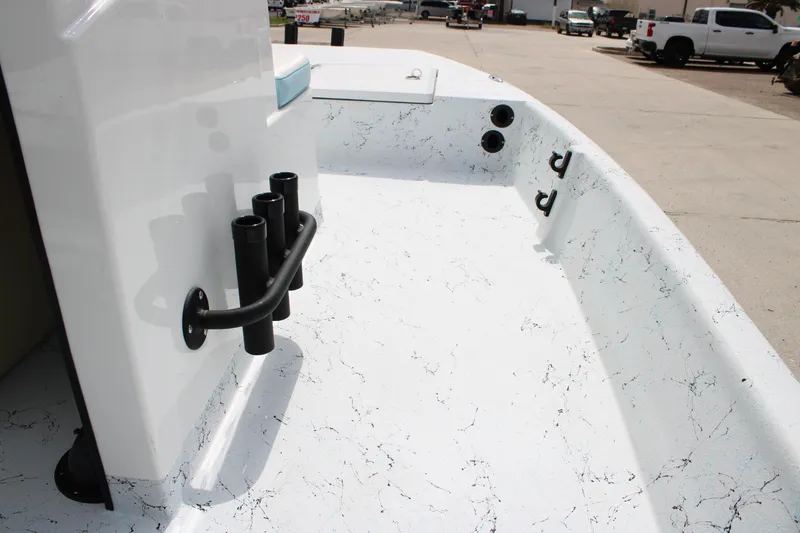 Slide: The Image of 2026 Freedom Boats 19 PATRIOT deck with rod holders and textured surface. - 16