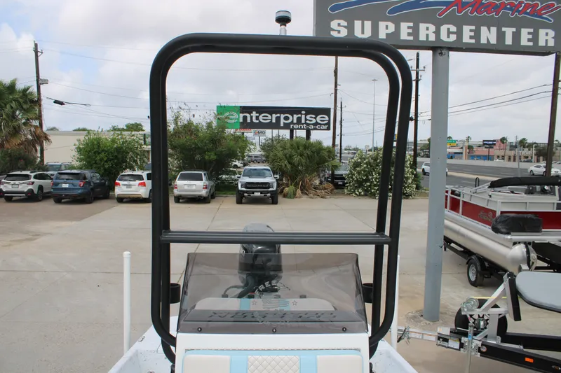 Slide: The Image of 2026 Freedom Boats 19 PATRIOT at marine supercenter, with cars and signage in background. - 20