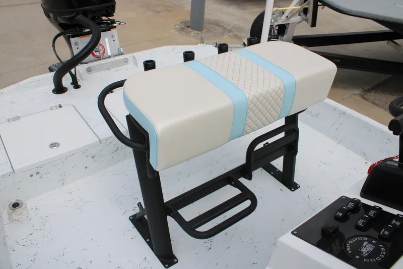 Slide: The Image of 2026 Freedom Boats 19 PATRIOT interior with cushioned seating and control panel. - 22