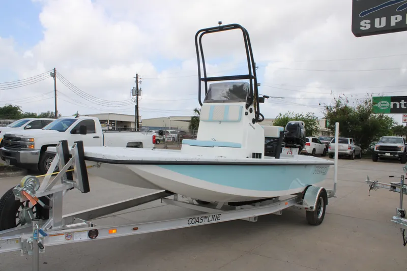 Slide: The Image of 2026 Freedom Boats 19 PATRIOT on trailer, displayed outdoors with vehicles in background. - 3