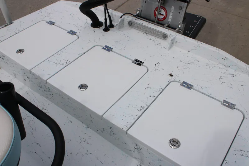 Slide: The Image of 2026 Freedom Boats 19 PATRIOT deck with storage compartments and control panel. - 8