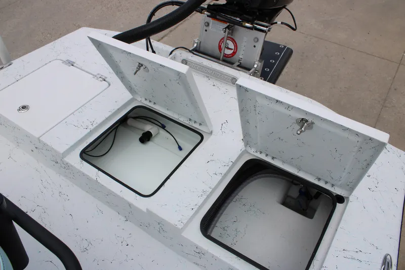 Slide: The Image of 2026 Freedom Boats 19 PATRIOT with open storage compartments and visible wiring. - 9