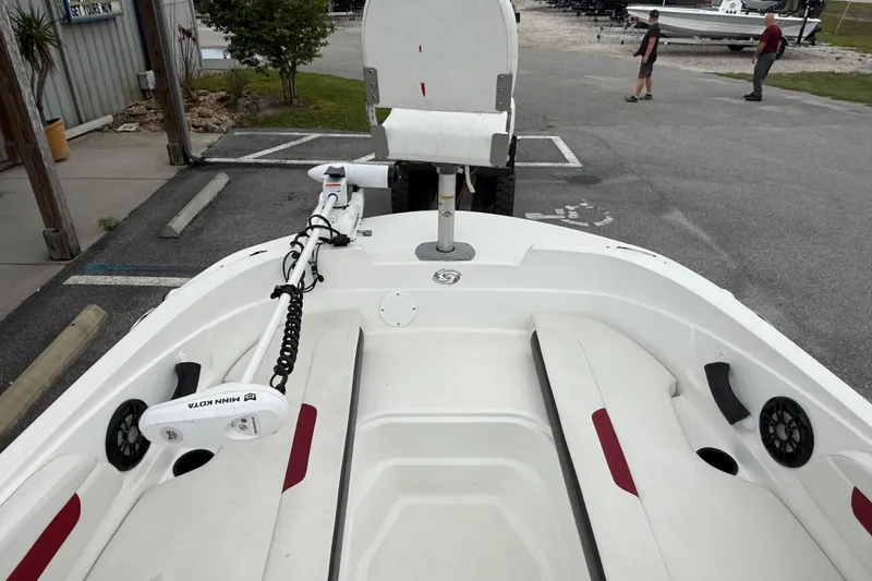 Slide: The Image of 2023 Hurricane SunDeck Sport 185 OB boat with Minn Kota trolling motor in parking lot. - 12