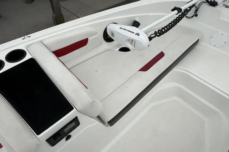 Slide: The Image of 2023 Hurricane SunDeck Sport 185 OB boat interior with seating and Minn Kota trolling motor. - 13