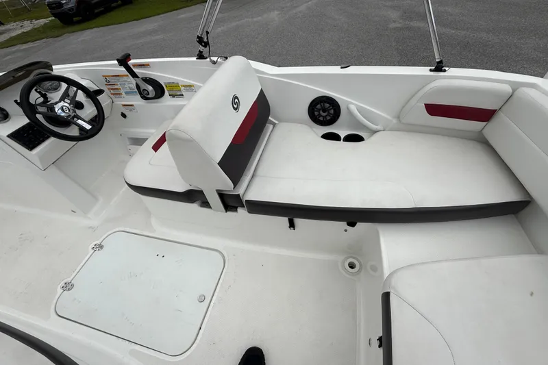 Slide: The Image of 2023 Hurricane SunDeck Sport 185 OB interior with white seating and steering console. - 19