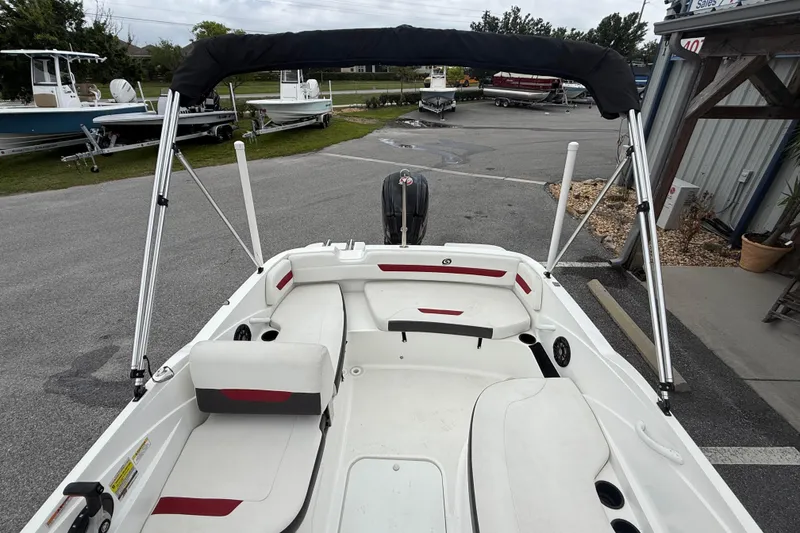 Slide: The Image of 2023 Hurricane SunDeck Sport 185 OB boat interior with seating and canopy. - 20