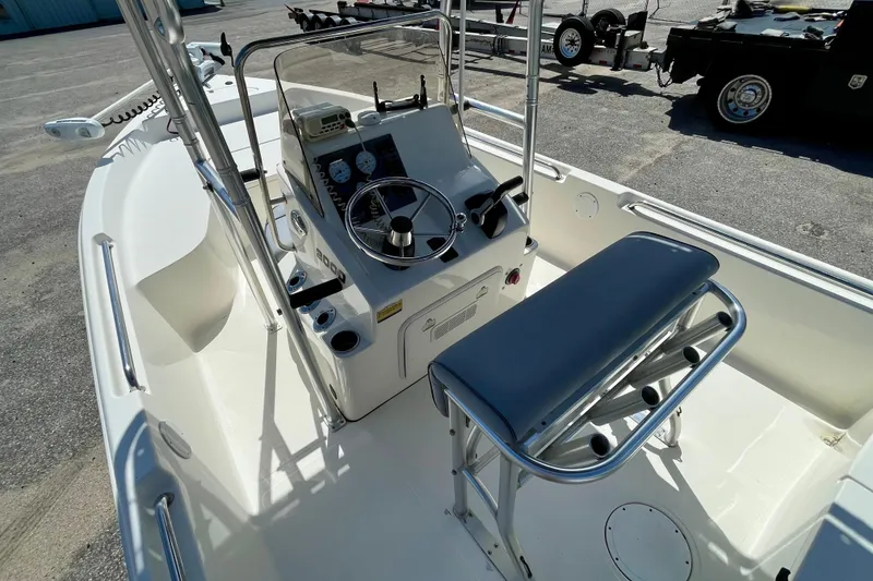 Slide: The Image of 2016 Bulls Bay 2000 boat interior with steering console and seating. - 12