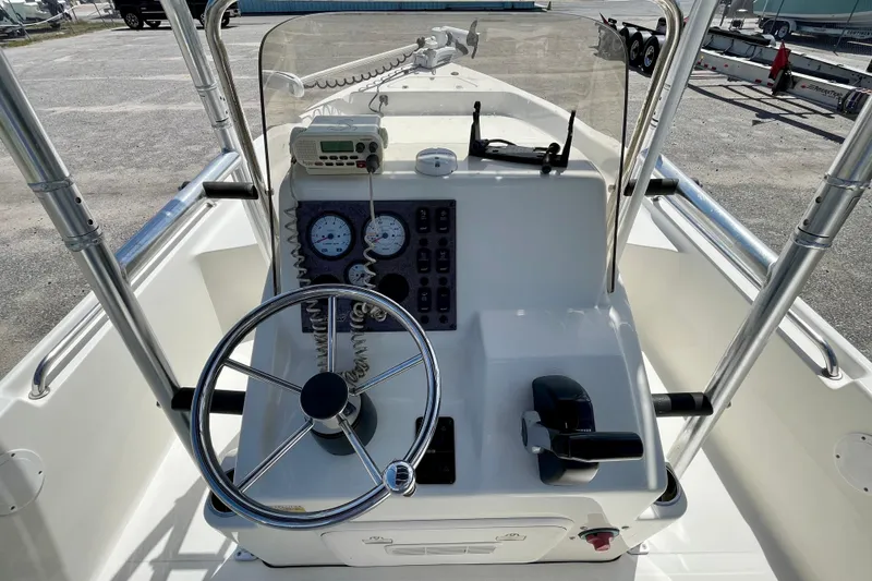 Slide: The Image of 2016 Bulls Bay 2000 boat console with steering wheel and control panel. - 13