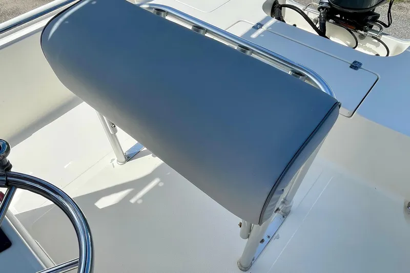 Slide: The Image of 2016 Bulls Bay 2000 boat interior with steering wheel and cushioned seat. - 14