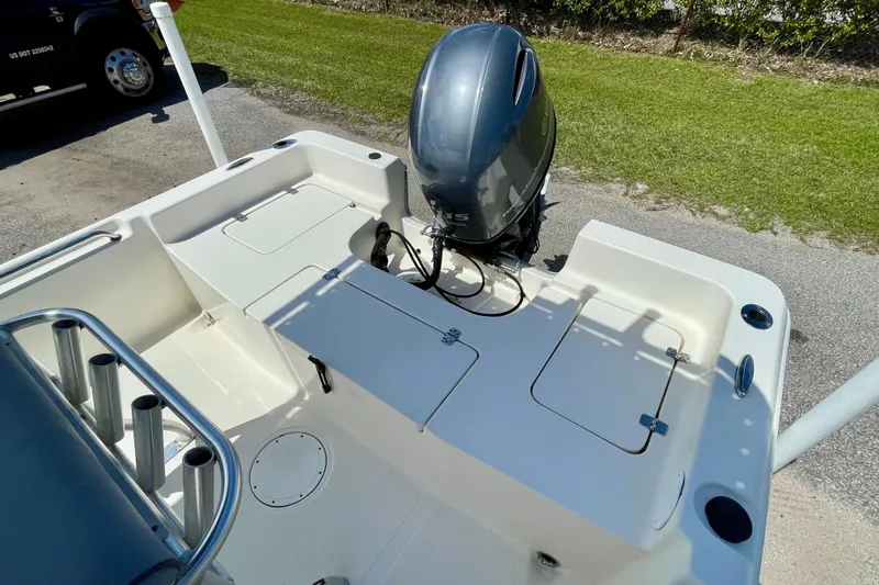 Slide: The Image of 2016 Bulls Bay 2000 boat with outboard motor, featuring spacious deck and storage compartments. - 15