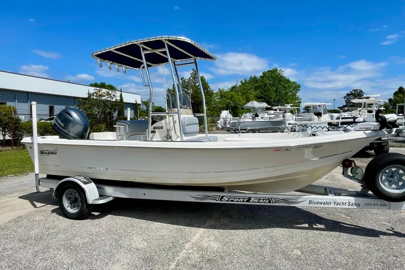 Slide: The Image of 2016 Bulls Bay 2000 boat on trailer, displayed outdoors under clear blue sky. - 4