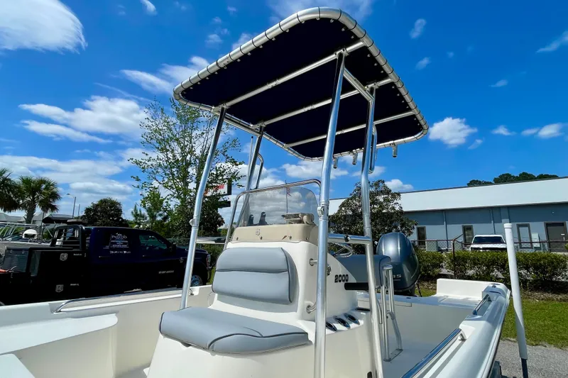 Slide: The Image of 2016 Bulls Bay 2000 boat with T-top under clear blue sky. - 8