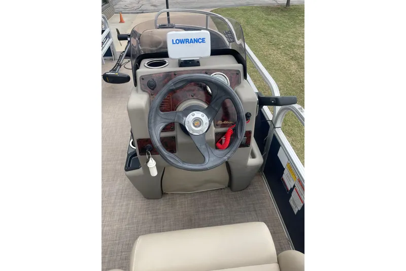 Slide: The Image of 2023 Sun Tracker Bass Buggy 16 XL Select steering console with Lowrance display. - 3