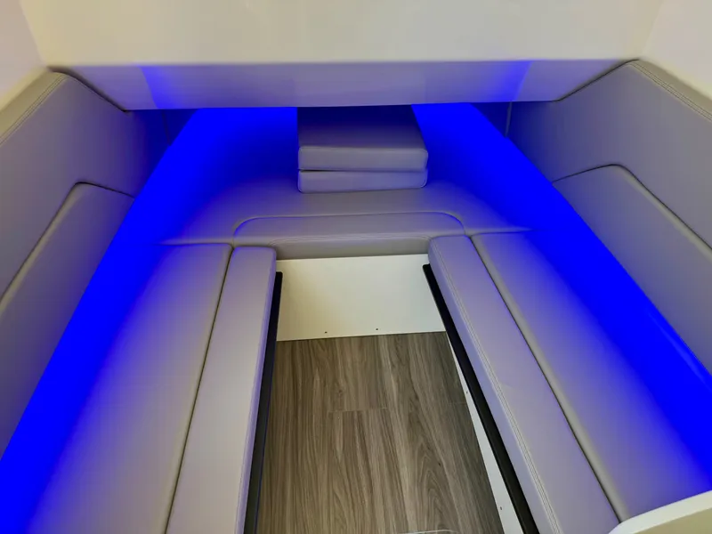 Slide: The Image of The 2027 Scout 330 LXF cabin features modern blue LED lighting and stylish upholstery. - 18
