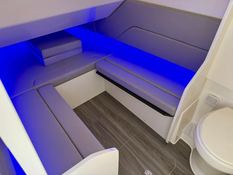 Slide: The Image of The 2027 Scout 330 LXF cabin features modern seating with blue LED lighting. - 17