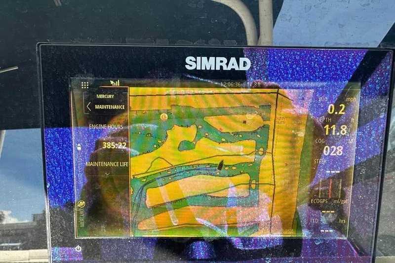Slide: The Image of Simrad marine display showing navigation and engine data for 2019 Sea Ray SDX 270 Outboard. - 10