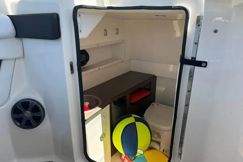 Slide: The Image of Interior cabin of 2019 Sea Ray SDX 270 Outboard with storage and seating. - 8