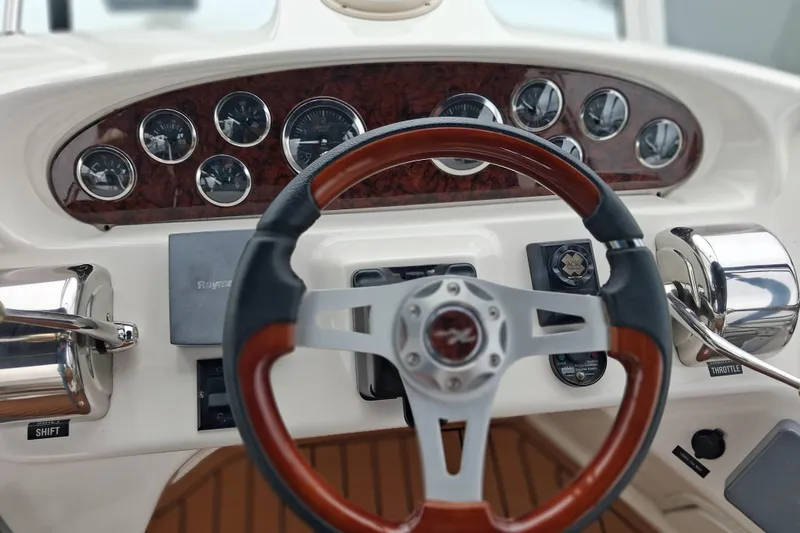 Slide: The Image of Helm of 2003 Sea Ray 400 Sedan Bridge with gauges and controls. - 14