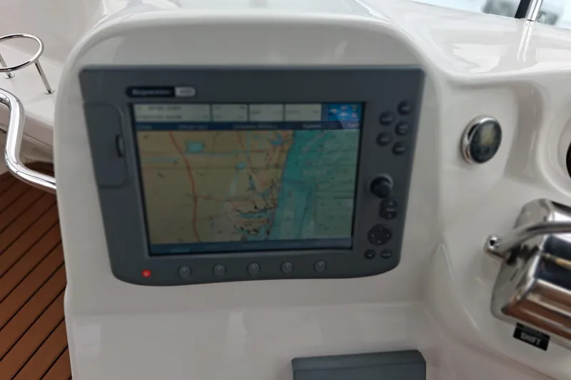 Slide: The Image of Navigation system on 2003 Sea Ray 400 Sedan Bridge yacht dashboard. - 19