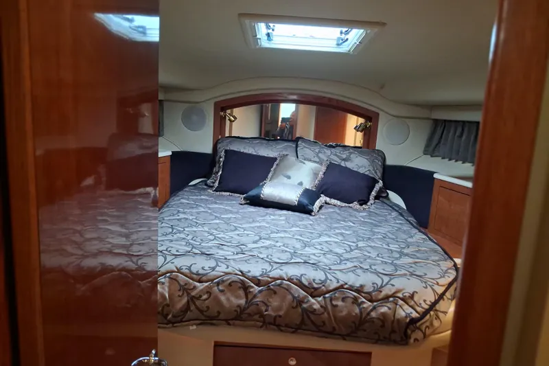 Slide: The Image of Luxurious bedroom interior of 2003 Sea Ray 400 Sedan Bridge yacht. - 24