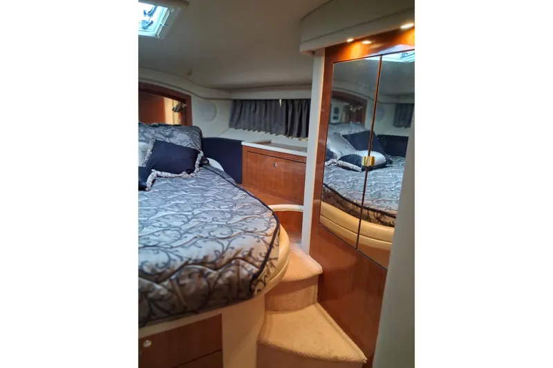 Slide: The Image of Luxurious interior of 2003 Sea Ray 400 Sedan Bridge yacht bedroom. - 36
