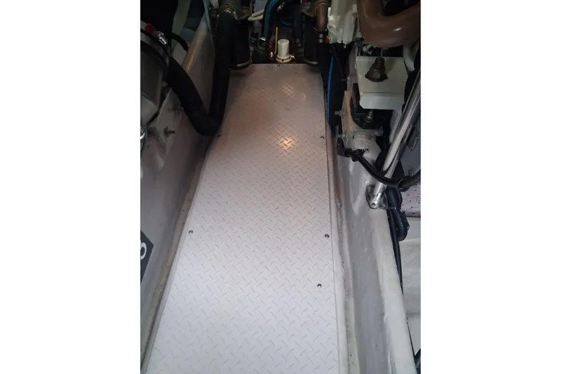 Slide: The Image of Engine room of 2003 Sea Ray 400 Sedan Bridge with visible components and wiring. - 39