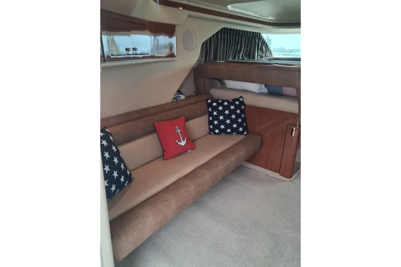 Slide: The Image of Interior of 2003 Sea Ray 400 Sedan Bridge with nautical-themed cushions. - 40