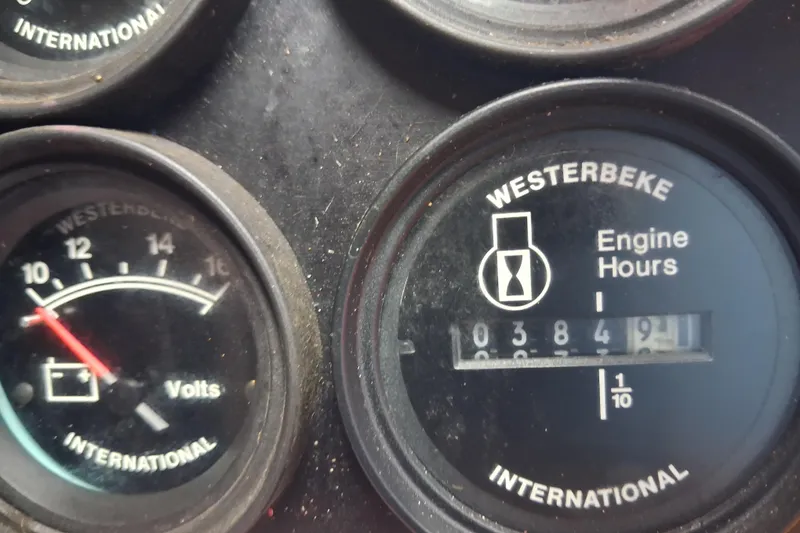 Slide: The Image of Close-up of Westerbeke engine hour meter and voltmeter on 2003 Sea Ray 400 Sedan Bridge. - 42