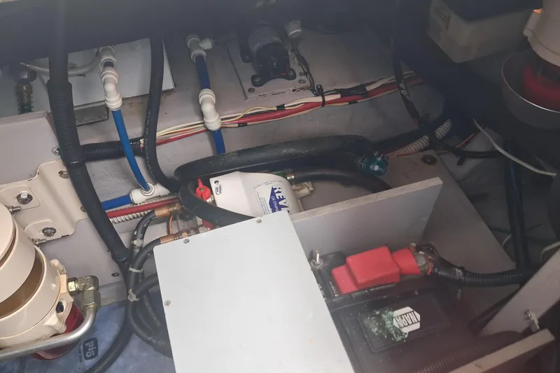 Slide: The Image of Engine compartment of a 2003 Sea Ray 400 Sedan Bridge with visible wiring and components. - 45