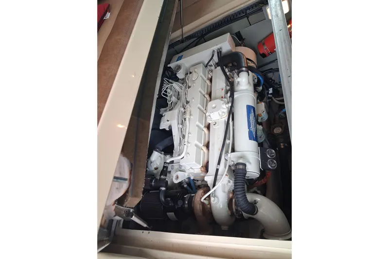 Slide: The Image of Engine compartment of a 2003 Sea Ray 400 Sedan Bridge yacht. - 48