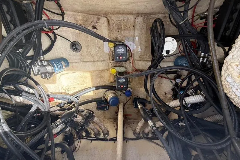 Slide: The Image of Interior view of 2022 Tidewater 272 LXF boat's wiring and plumbing system. - 12
