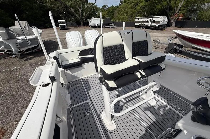 Slide: The Image of 2022 Tidewater 272 LXF boat interior with dual seats and sleek design. - 17