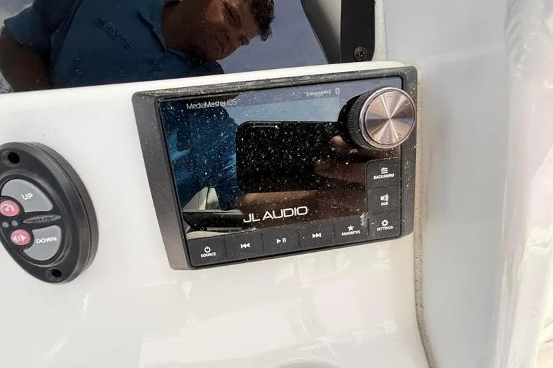 Slide: The Image of JL Audio system on 2022 Tidewater 272 LXF boat dashboard. - 21