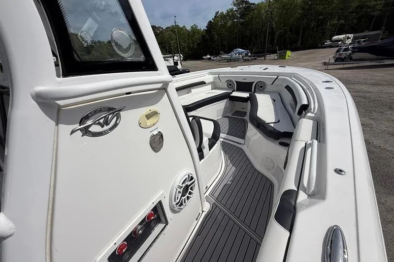 Slide: The Image of 2022 Tidewater 272 LXF boat interior with seating and modern design. - 25