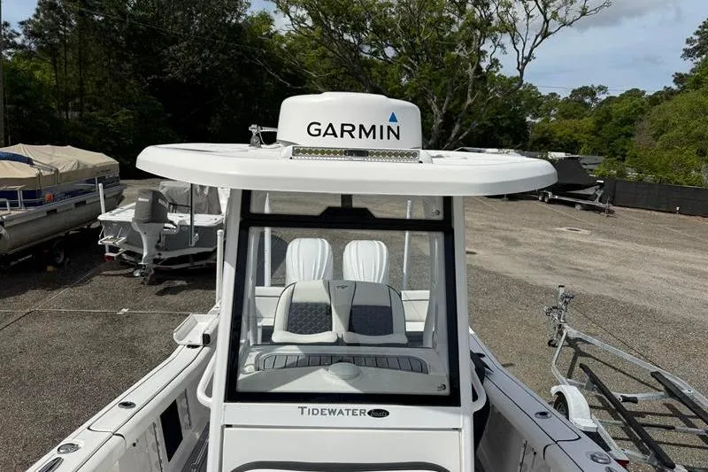 Slide: The Image of 2022 Tidewater 272 LXF boat with Garmin equipment, parked outdoors. - 31