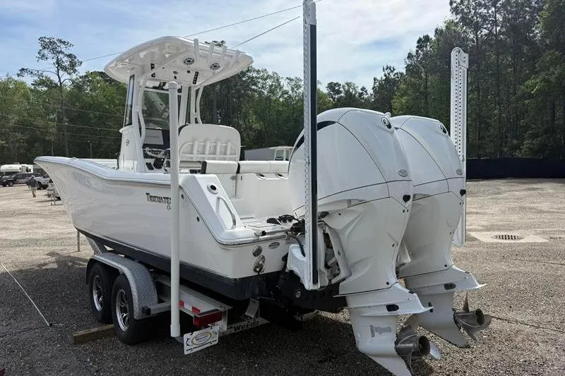 Slide: The Image of 2022 Tidewater 272 LXF boat on trailer with dual outboard engines. - 4