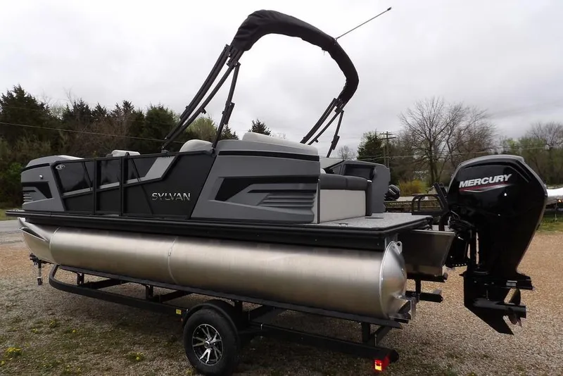 Slide: The Image of 2026 Sylvan R-20 CLZ DH pontoon boat with Mercury outboard engine on trailer. - 12