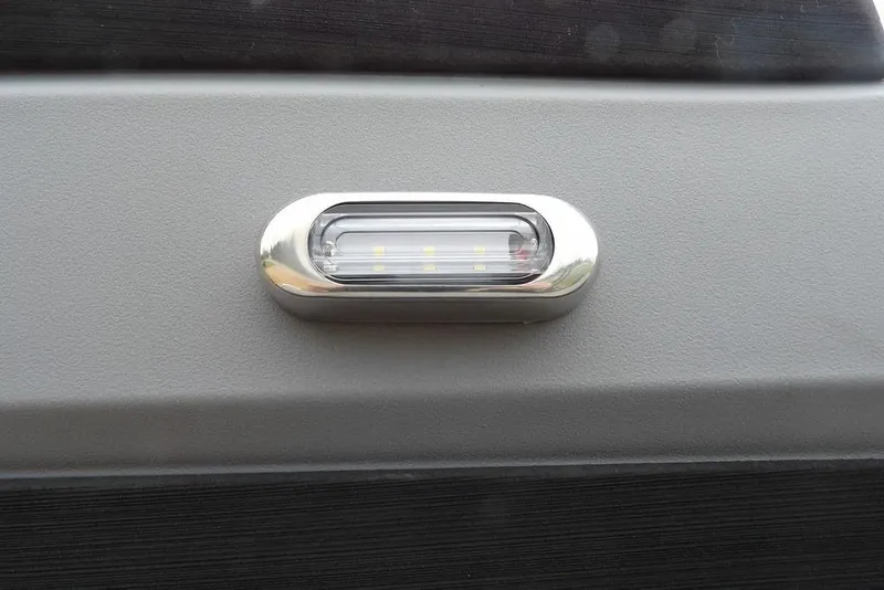 Slide: The Image of LED light on 2026 Sylvan R-20 CLZ DH boat exterior. - 14