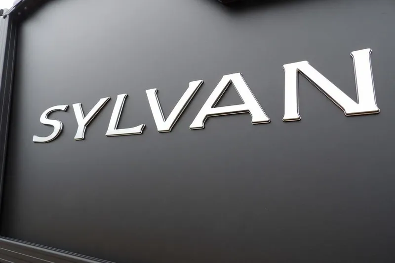 Slide: The Image of Sylvan logo on 2026 R-20 CLZ DH model, metallic lettering on dark background. - 15