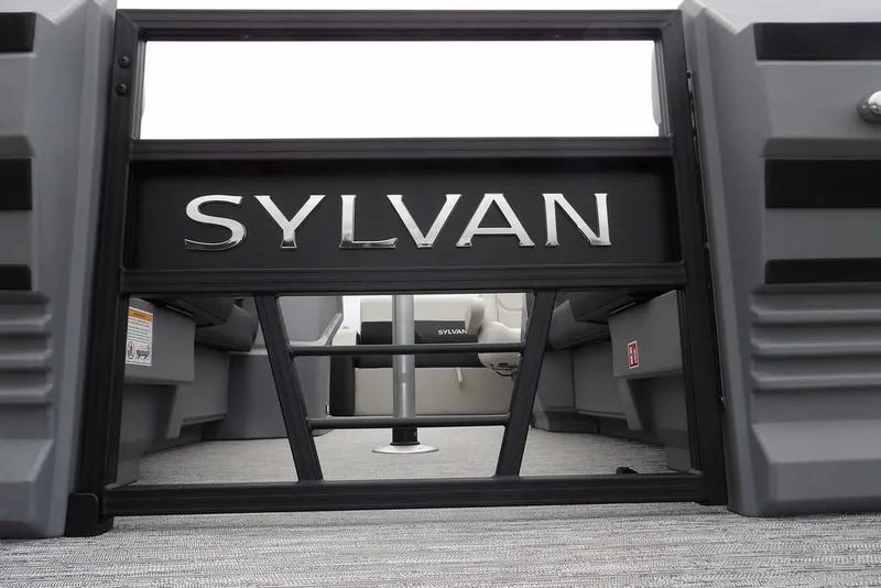 Slide: The Image of 2026 Sylvan R-20 CLZ DH boat interior with logo and seating area. - 16