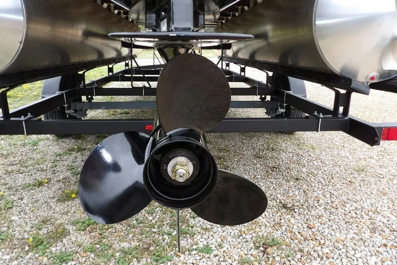 Slide: The Image of Propeller of 2026 Sylvan R-20 CLZ DH pontoon boat on trailer, rear view. - 17
